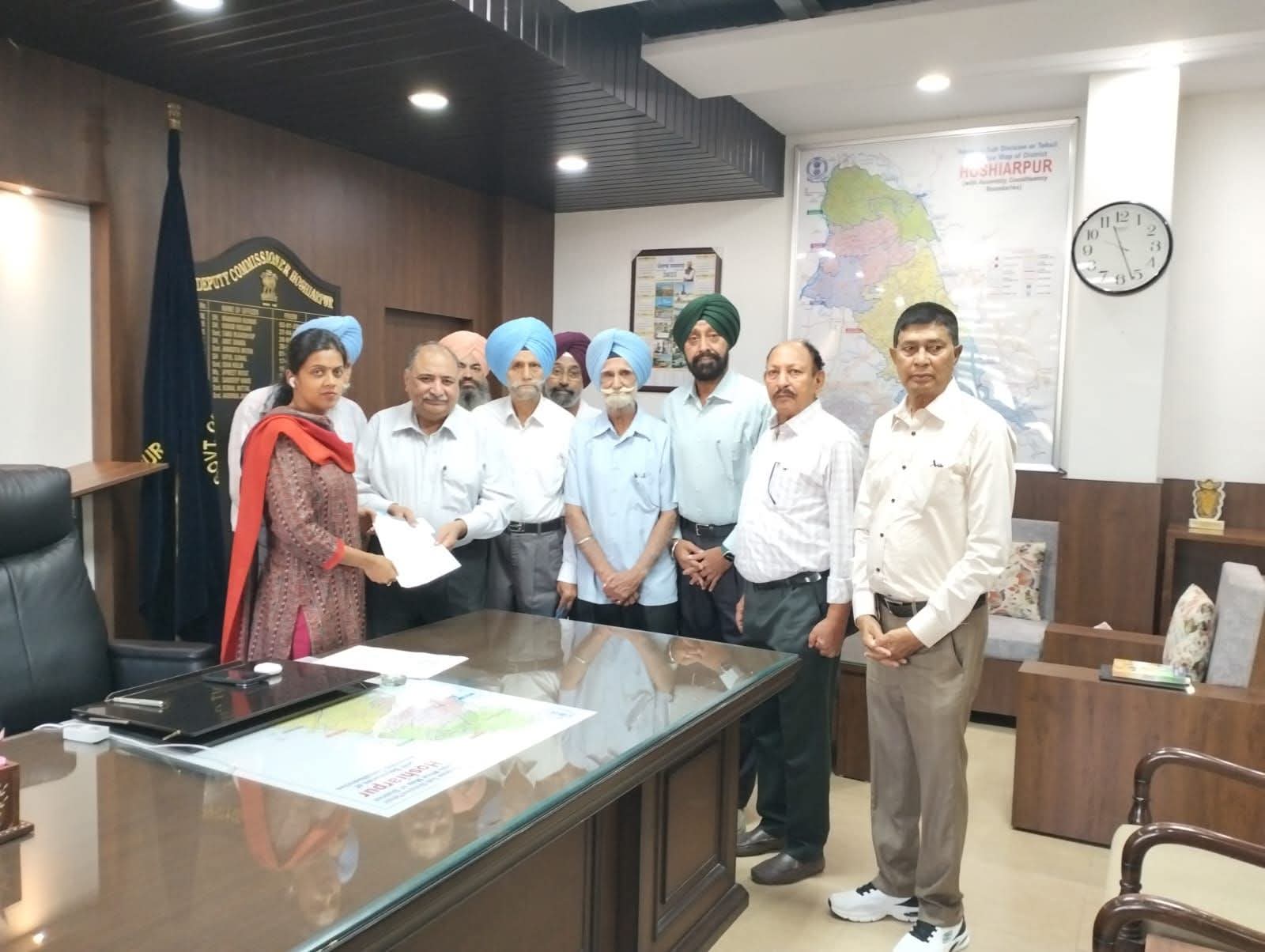 Retired Agriculture Technocrats Association donates Rs 4 lakh to DC for flood victims.